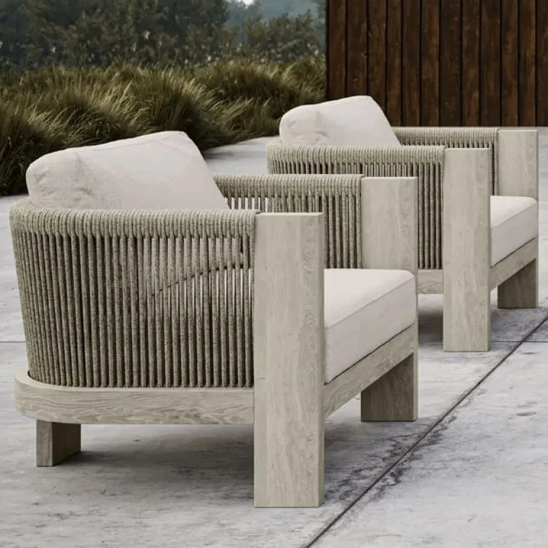 Outdoor garden armchair made of teak wood and woven acrylic, the fabric used for the cushions is waterproof and UV resistant.