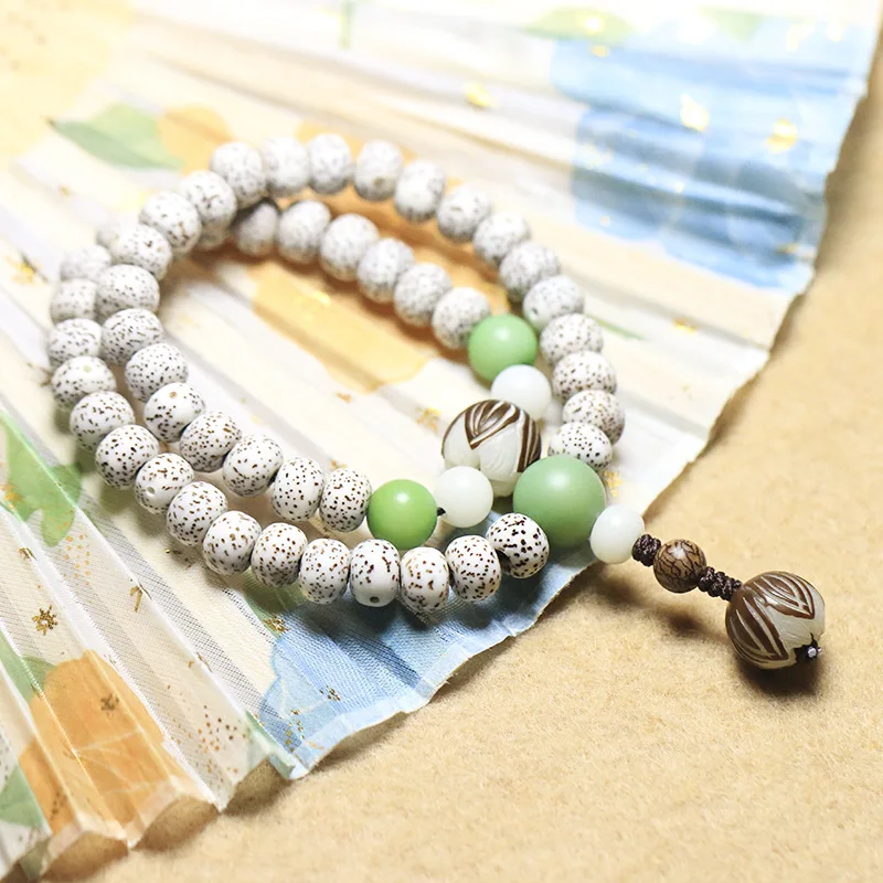 

Hainan Xingyue Bodhi child Buddha bead bracelet high density shunbai Zhengyue Bodhi Bracelet men and women hand string beads