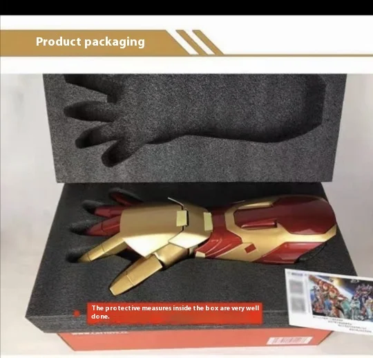 Close-up view of Iron Man armor gauntlet showing laser light function and palm-sized LED lighting system in action