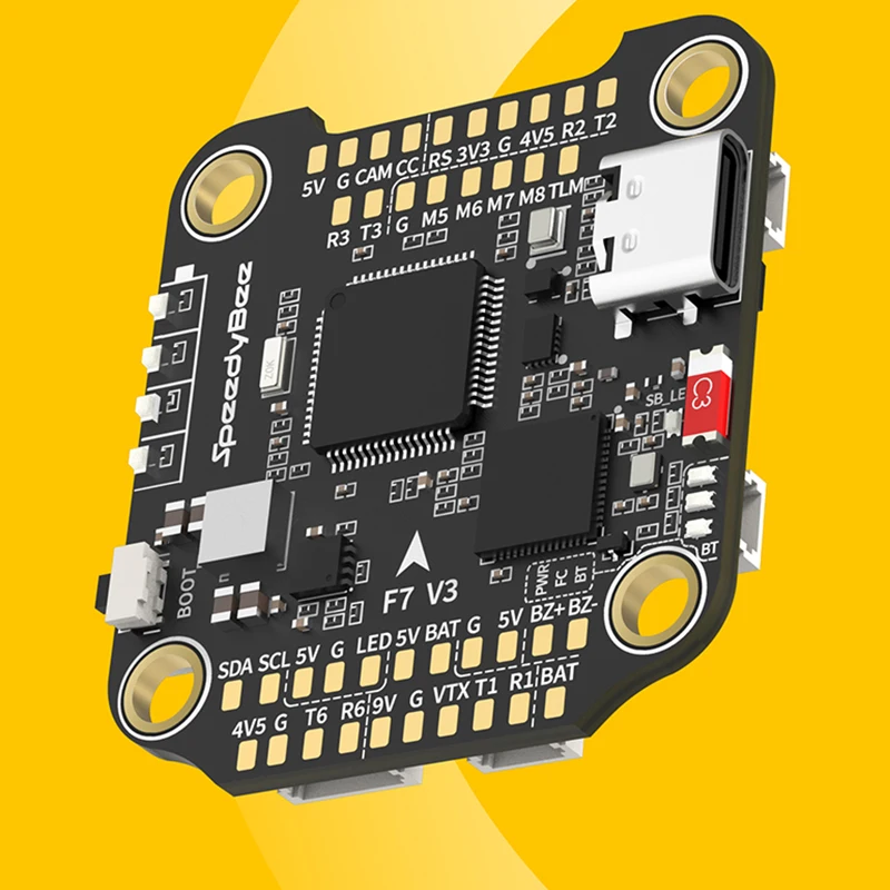 Stack SpeedyBee F7 V3 installé dans un châssis de drone, câbles et soudures apparents, achetez ce contrôleur de vol.