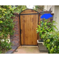 A black gate frame is installed in the courtyard Gate Frame, 8 Standard Fence Board Wide x 6’ Long, Black, 6 Foot homegate 1