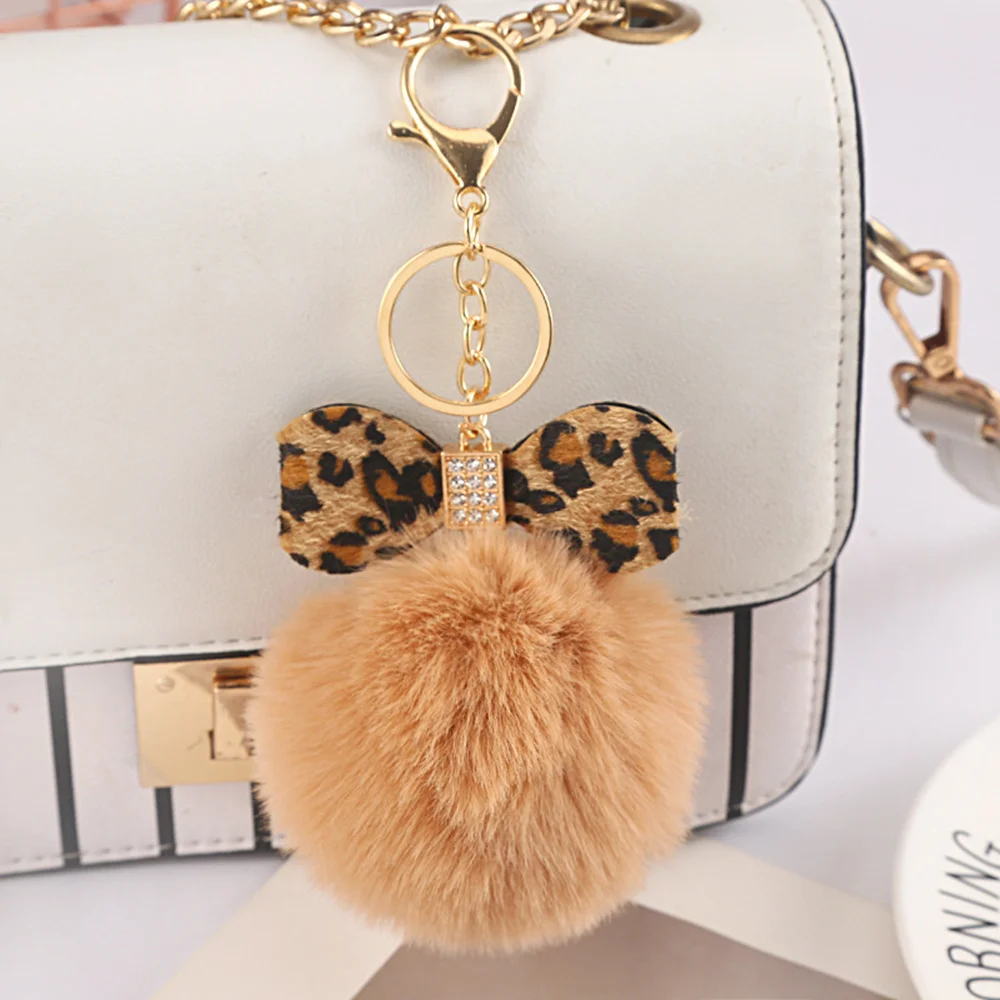 PRETYZOOM Butterfly Pom Pom Keychain Artificial Fur Ball Keychain Fluffy  Accessories Car Bag Charm Fuzzy Ball Pendant at  Women's Clothing  store