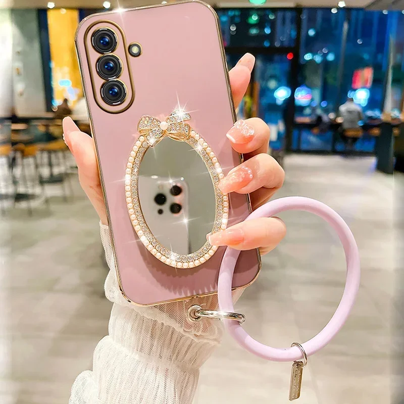 Custodia a specchio ovale con fiocco per Samsung A05S A73 A21S A34 A12 A54 A25 A33 A24 A32 5G A23 A53 A13 4G A14 A04S Braccialetto da polso_voghion.com