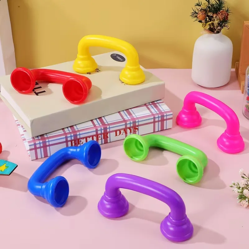 Set of Silent Reading Telephones with Auditory Feedback for Enhanced Pronunciation and Fluency