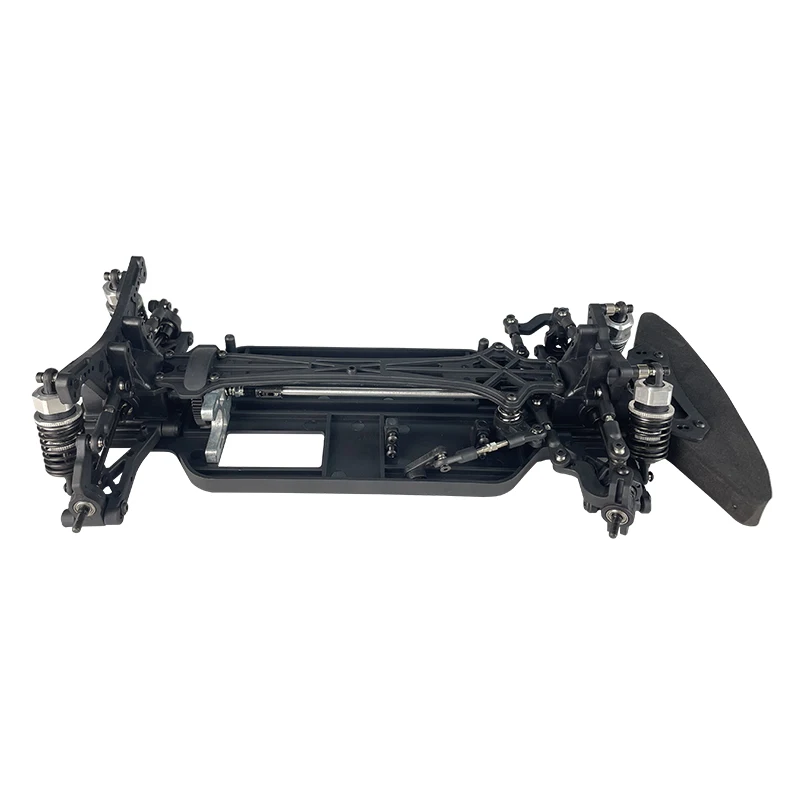 Détail du train avant du kit RC touring VRX Racing avec suspensions et direction, sans électronique.