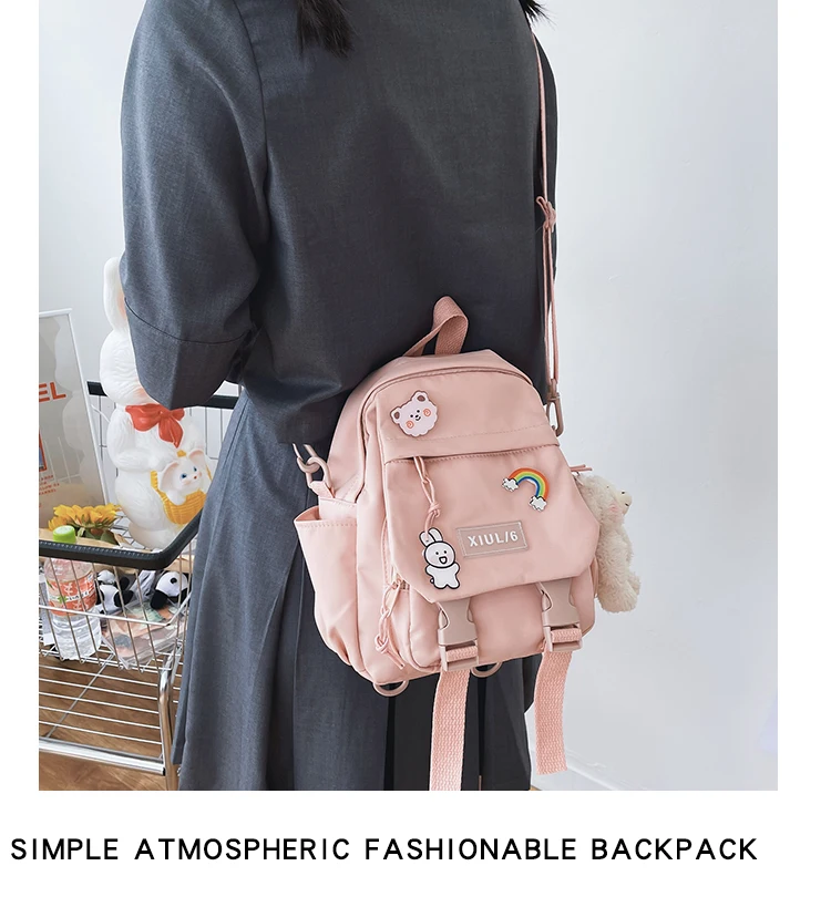 Small pastel backpack for women and girls with dual-use straps, kawaii design, and roomy compartments for school, travel, and casual wear.03