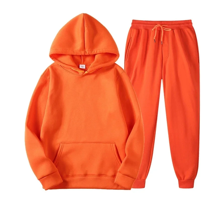 Woman wearing matching hoodie and sweatpants set in a cozy autumn outdoor setting orange