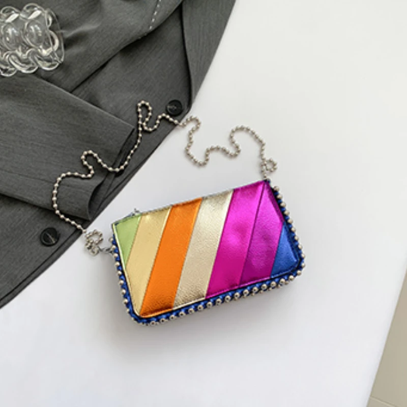 thumbnail image 1 of Bolso de hombro de PU con diseño de arcoíris y bloques de color de gran venta, bolso cruzado de moda para mujer 2024, nuevo bolso cruzado con cadena y cremallera de diamantes para mujer, 1 of 5