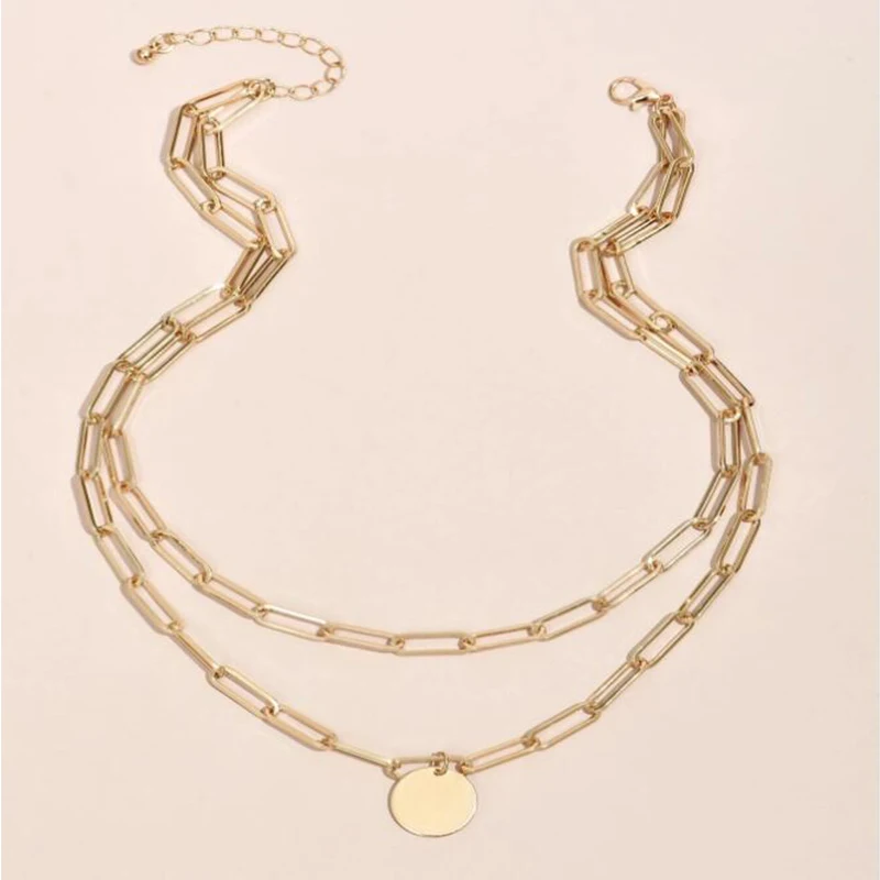 A trendy Charm Layered Necklace for Women with a fashionable coin pendant.