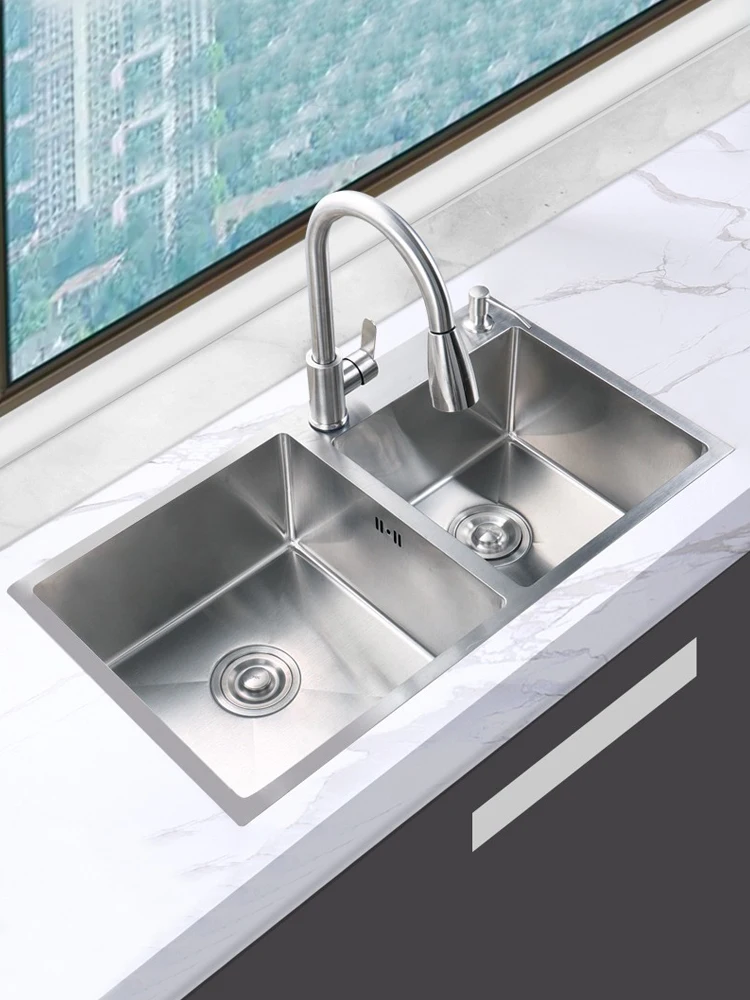 

Kitchen sink silver double-slot thickened 304 stainless steel household hand-washing basin under the stage of the sink.