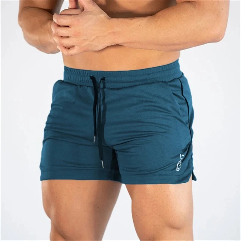 Calções masculinos de esportes fitness, calções masculinos de treino de ginástica, calções de malha respirável, calças curtas de praia secagem rápida, roupas esportivas, verão, 2023