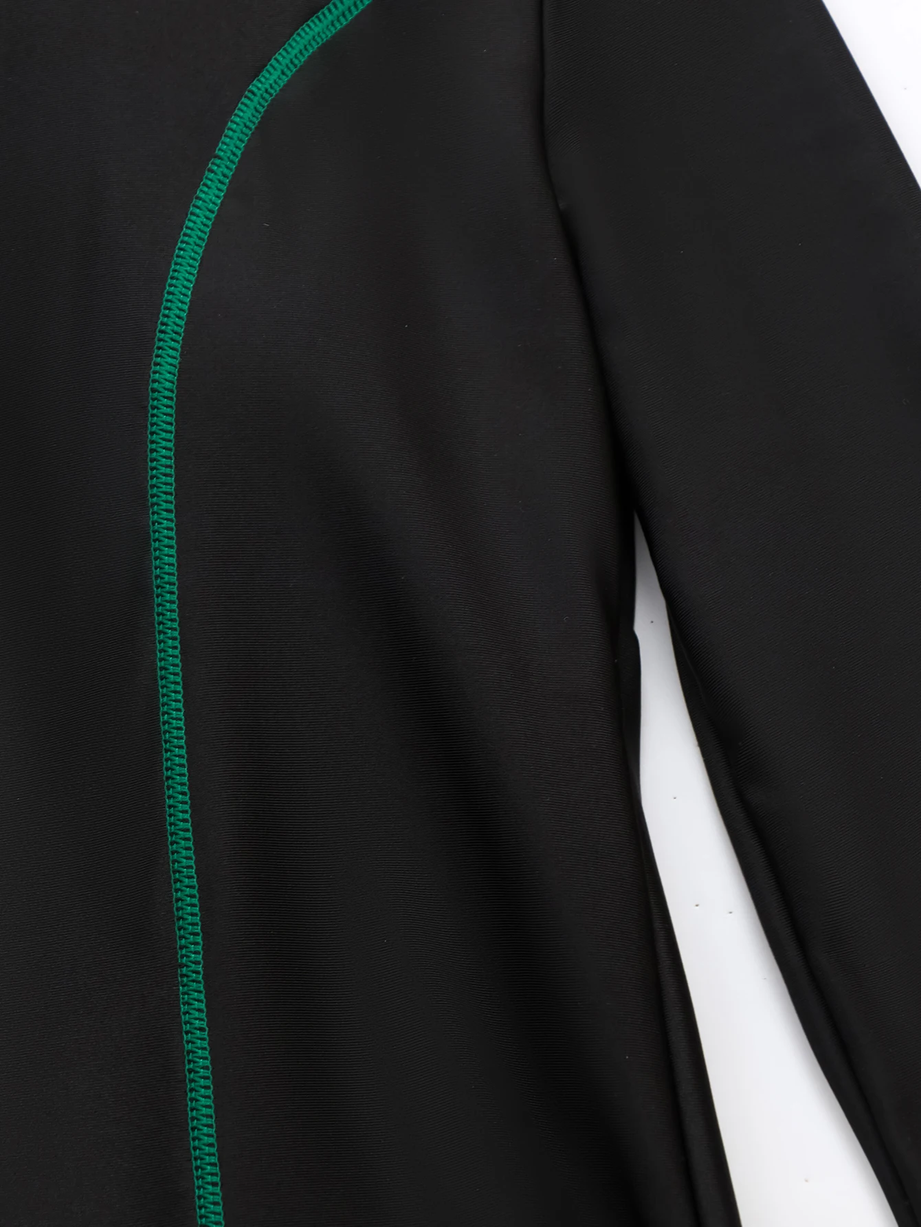 Muslim woman swimming in Islamic swimsuit with matching scarf