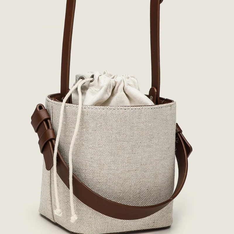 Women's canvas bucket bag, small slanted shoulder handbag, fashionable solid color, casual, going out for work and commuting