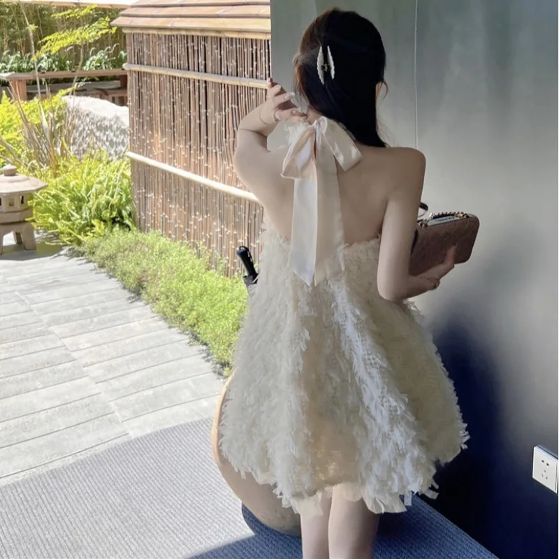 

Модное свободное пикантное дизайнерское короткое платье с открытой спиной и подвесным воротником с кисточками женское весеннее Платье женское винтажное платье с бантом на шнуровке