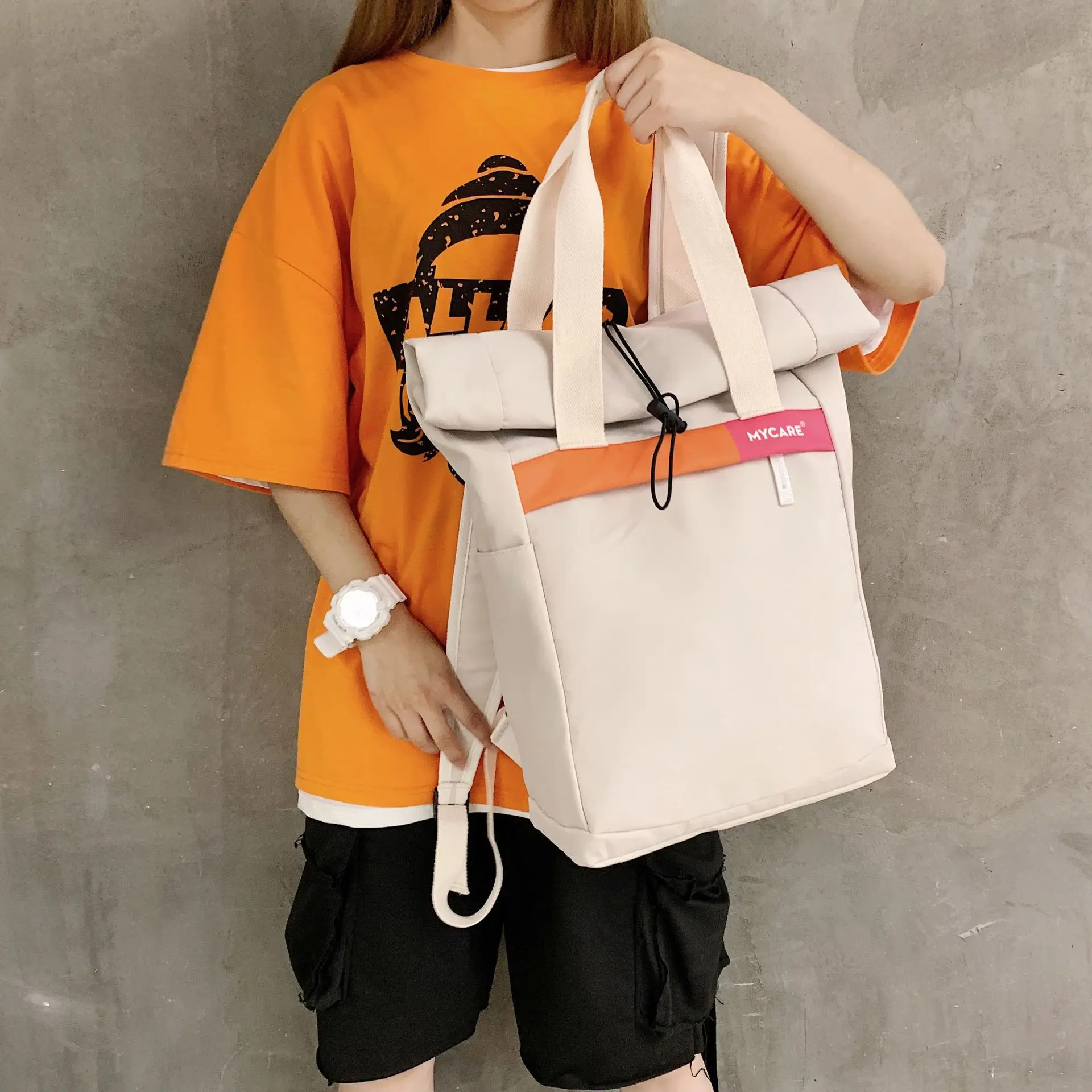 The new Korean version of the contrast color bucket backpack men's casual campus student backpack schoolbag backpack women