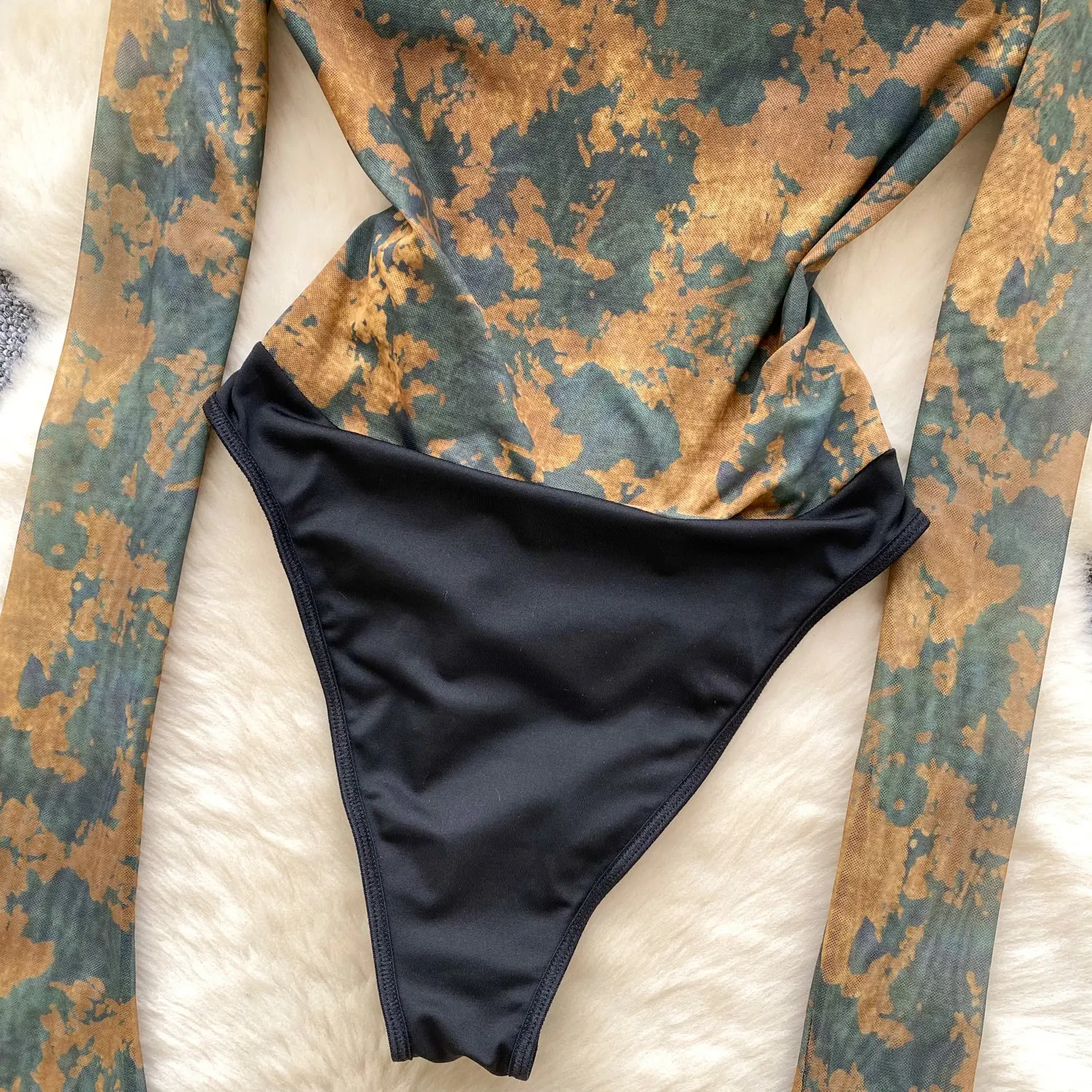 flattering waist detail on mesh bodysuit
