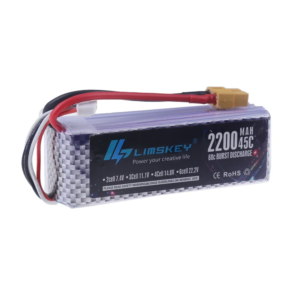 Batterie Lipo 4S pour drone posée sur une surface, montrant son boîtier noir et ses câbles.