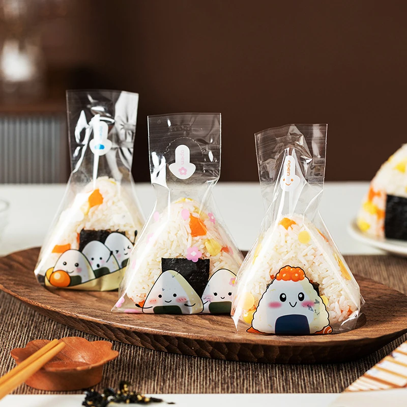 

100Pcs Cute Cartoon Disposable Japanese Triangle Rice Ball Packaging Bag Sushi Bag Sushi Making Mold Lunch Box Accessories