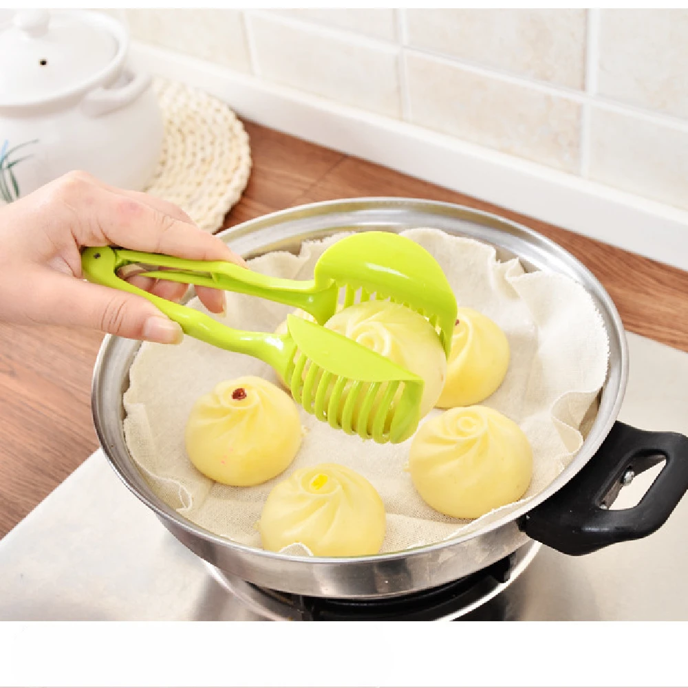 https://ae01.alicdn.com/kf/S4b35c3d46e394f1aa7302c58de450092C/Handheld-Tomato-Onion-Slicer-Bread-Clip-Fruit-Vegetable-Cutting-Lemon-Shreadders-Potato-Apple-Gadget-Kitchen-Accessories.jpg