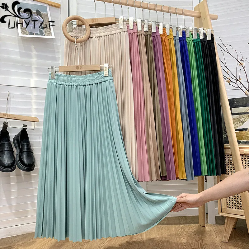 

UHYTGF Pleated Skirt Women Korean Spring Summer Elastic Waist Mid-Length Loose High-Waisted Large Swing One Size Ladies Skirt176