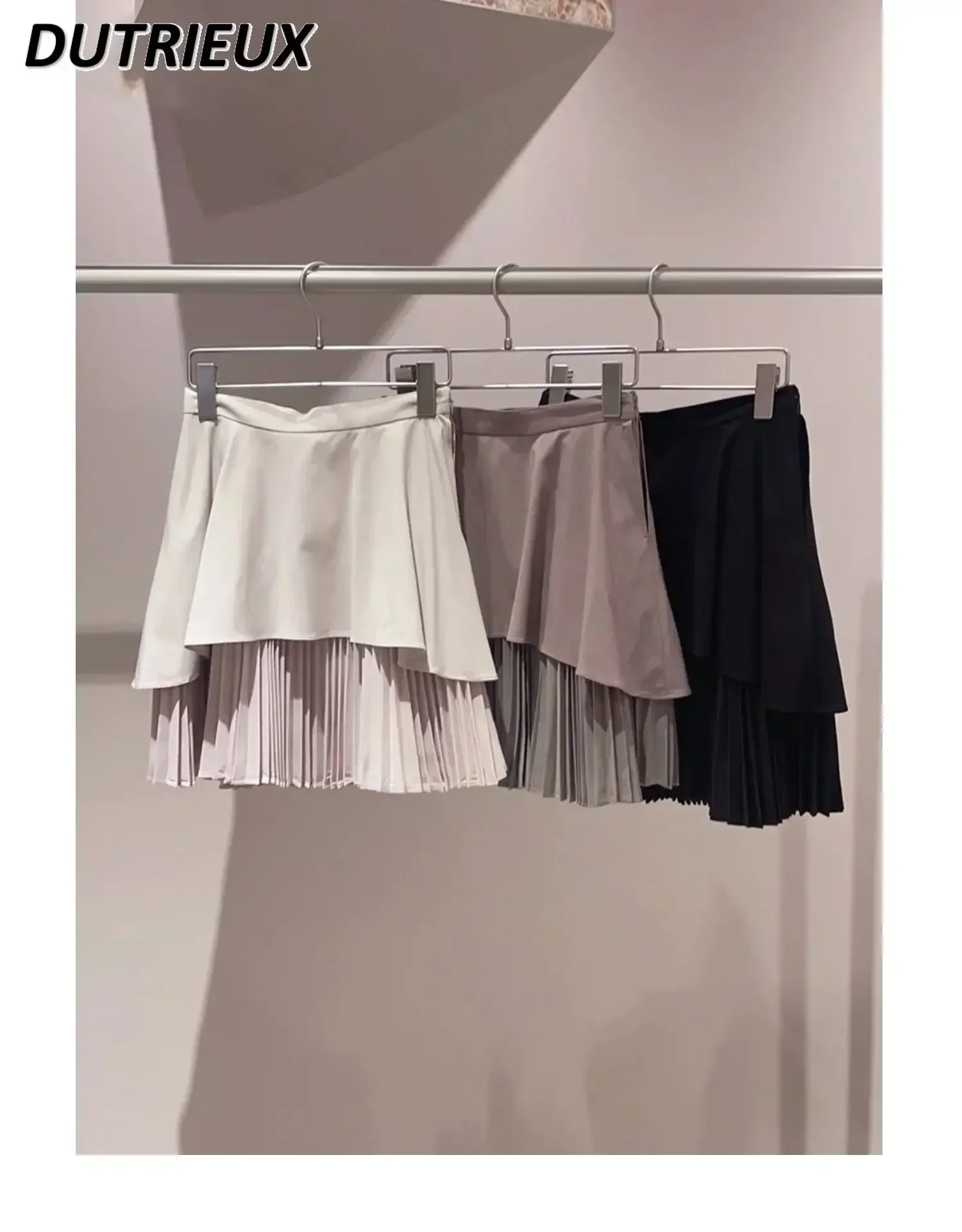 japanese-style-2023-early-autumn-new-pure-color-all-matching-mini-short-skirt-irregular-stitching-pleated-mini-skirt-for-women