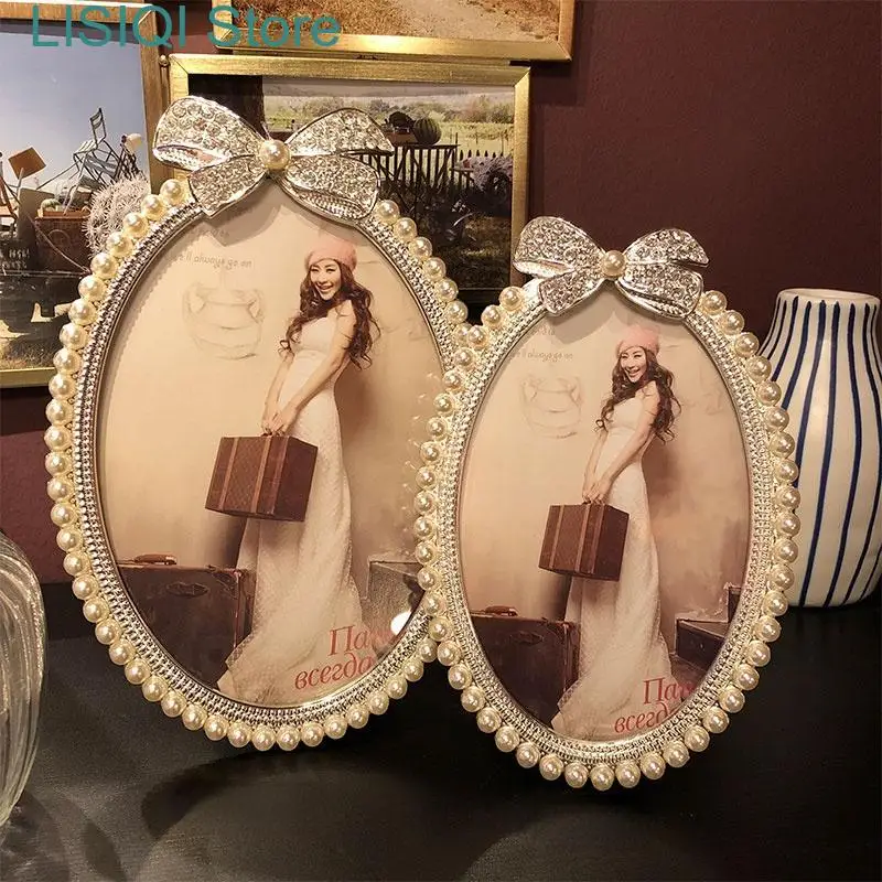 

New Metal Oval Photo Frame Crystal Bow Pearl Photo Storage Display Wedding Decorations Picture Frame Baby Picture Frames Decor