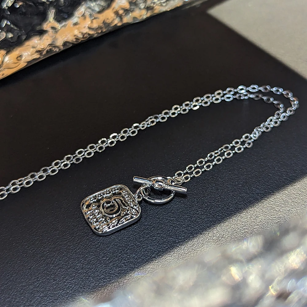 

Amorita boutique Retro metal small square brand embossed "5" pendant necklace