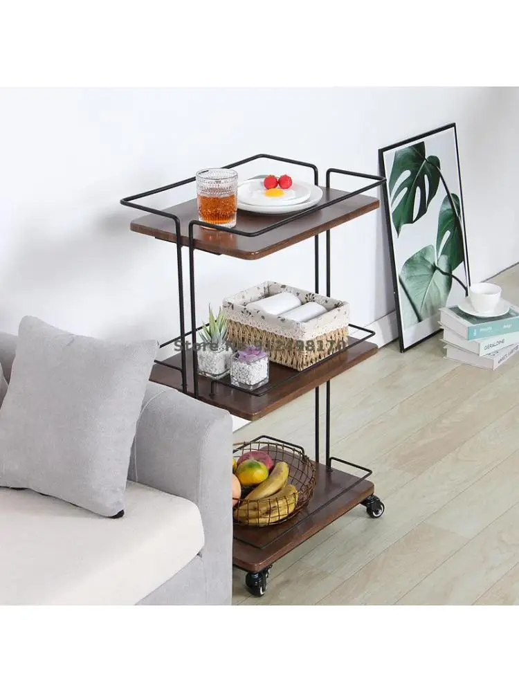 A few corners on the side of a Japanese sofa, a movable iron dining car, multi-layer rack, kitchen storage rack, living