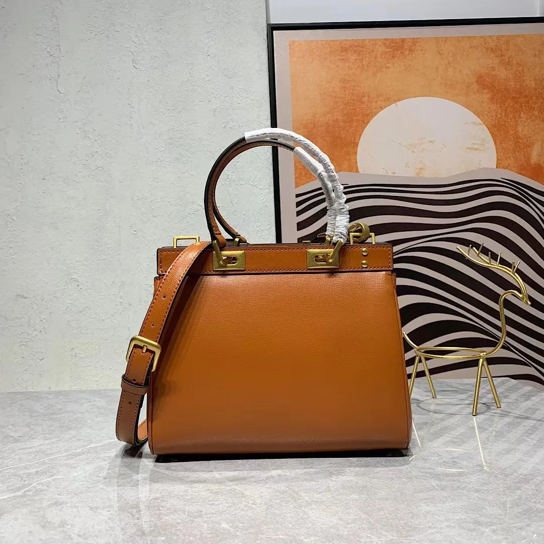 

2023 Grain New Small Leather Designer's Metal Rivet Versatile High Quality Fashion Retro Multi functional One Shoulder Handbag