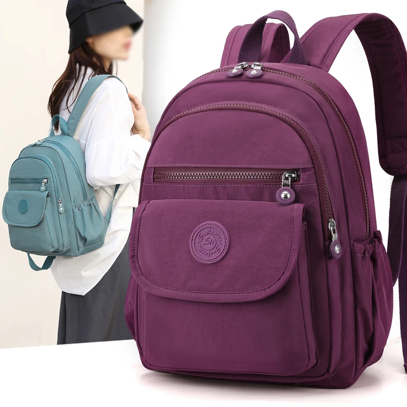 Ladies' lightweight, large capacity stylish black commuter travel backpack with adjustable shoulder straps, school and leisure b