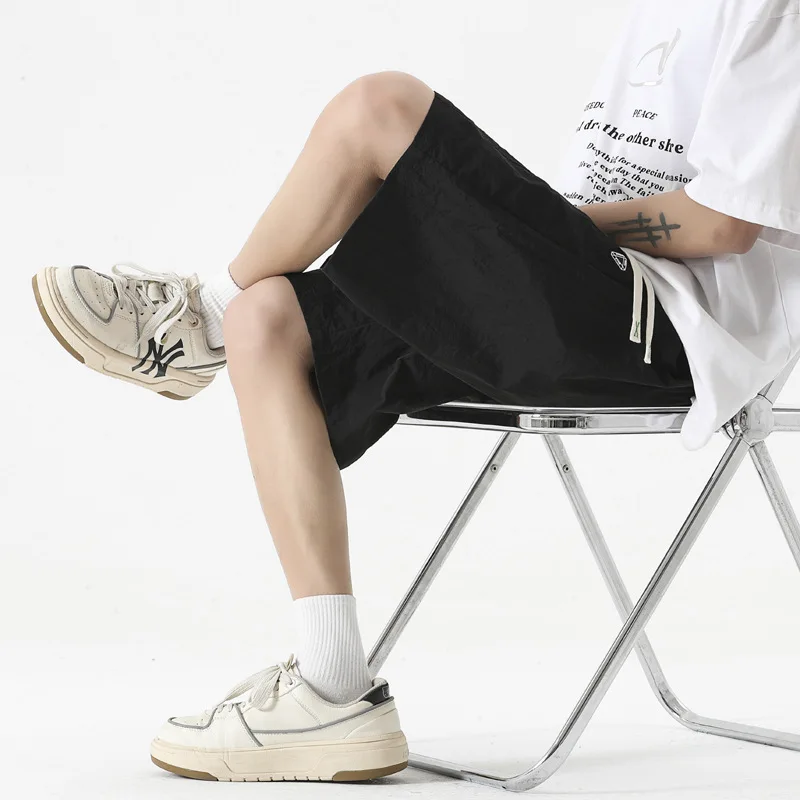 Large size casual shorts, quick drying and breathable capris, men's large size loose trendy casual sports ice silk pants