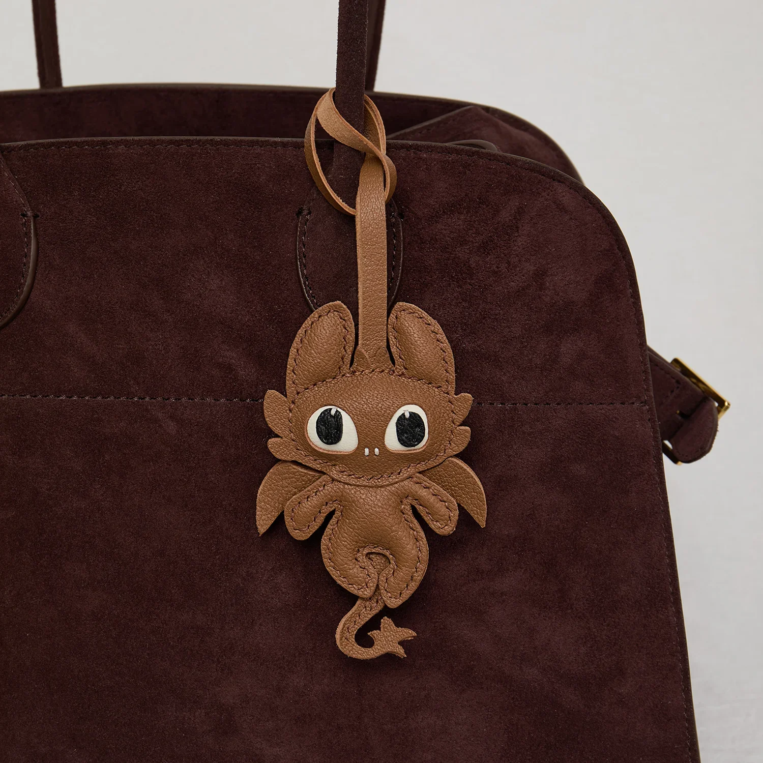Dragon leather bag charm side detail
