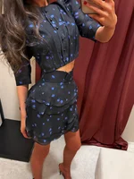 Ensemble 2 pièces sexy pour femme : haut court en mousseline à manches bulles et col rond, et mini-jupe superposée à imprimé floral – Collection été 2026 5