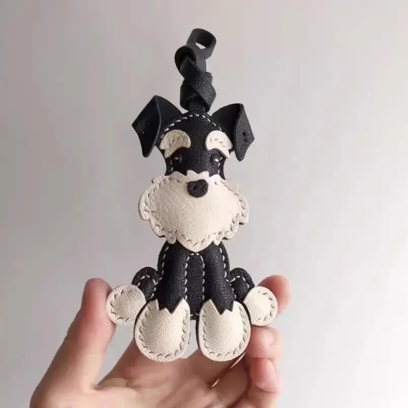 Schnauzer leather charm hanging on handbag