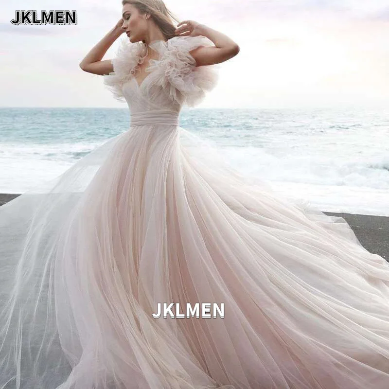 Фото Сказочное пляжное свадебное платье 2021 светильник-розовое с оборками на рукавах