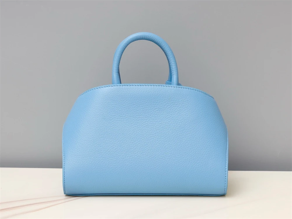 Bolso Mini HUG con estructura de hebilla estilo Hug, bolso de mano de piel de vaca suave, bolso de hombro para damas 2024