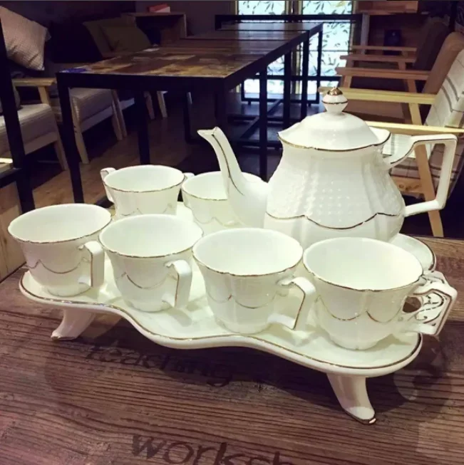 

New 2024 European Modern Afternoon 6pcs Gold Rim Porcelain Tea Cup Teapot Set With Tray Ceramic Coffee Pot And Cups Saucers Set