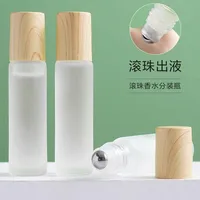 200pcs High Quality 5ml 10ml clear Roller Ball Matte Glass Roll on Bottle with Wood Bamboo Lid 1