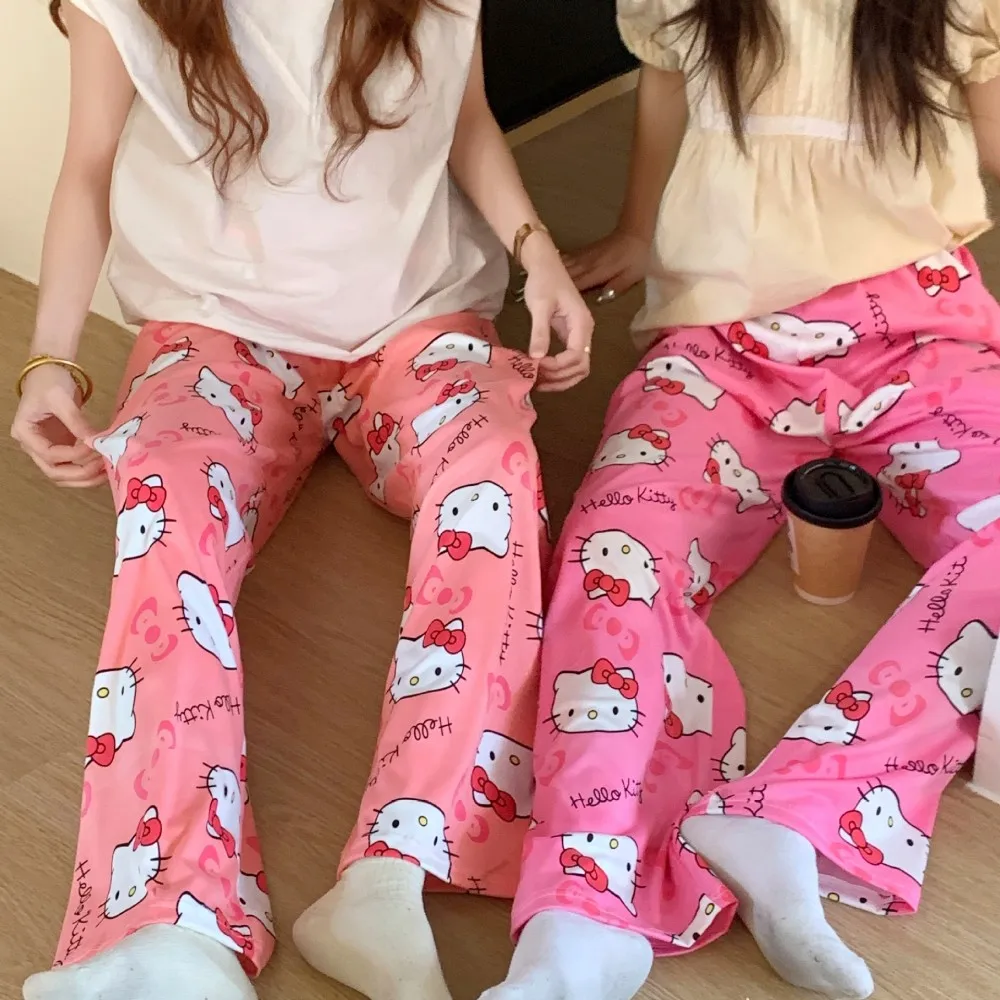 A pair of loose-fitting Hello Kitty pajama pants with a charming cartoon print red
