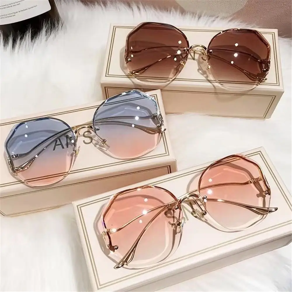 

2023 Fashion Gradient Sunglasses Women Ocean Water Cut Trimmed Lens Metal Curved Temples Sun Glasses Vintage Rimless Sunglasses