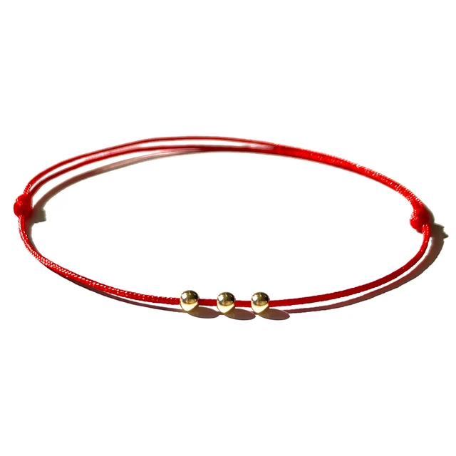 Red string bracelet hi-res stock photography and images - Alamy