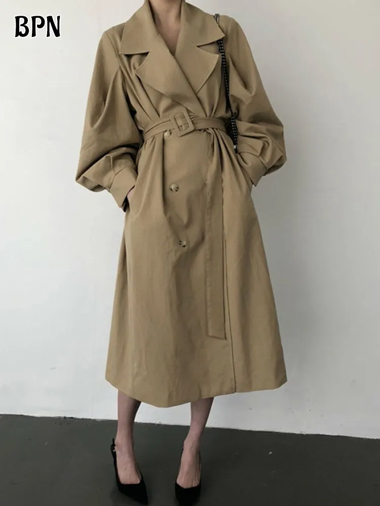 

BPN Solid Spliced Belted Windbreaker For Women Lapel Long Sleeve Patchwork Double Breastd Casual Slimming Trench Female Clothing