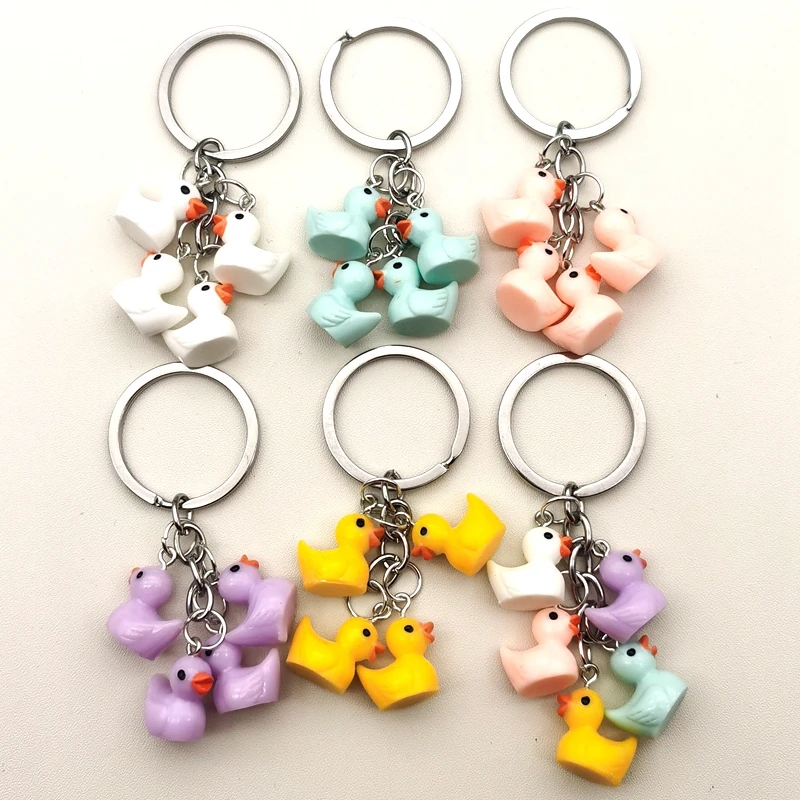男性と女性のための5つのミニイエローダックキーホルダー,創造的な樹脂