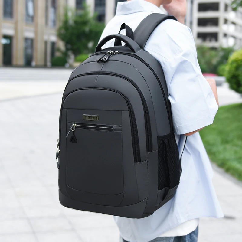 Large-capacity backpack with adjustable shoulder straps, multiple compartments, and durable polyester material, suitable for tra