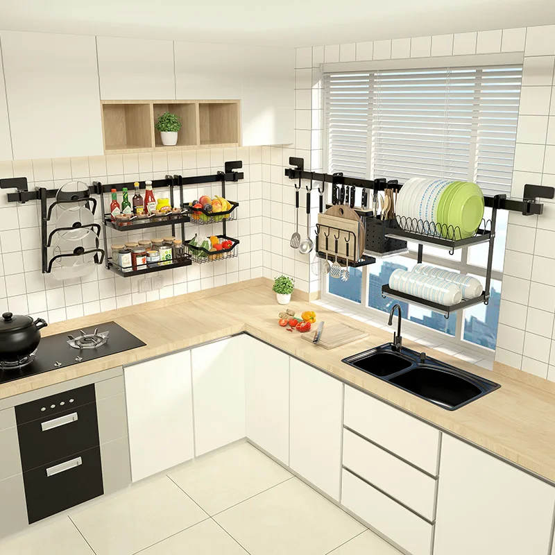 Black stainless steel kitchen racks drain above the wall-hung sink.