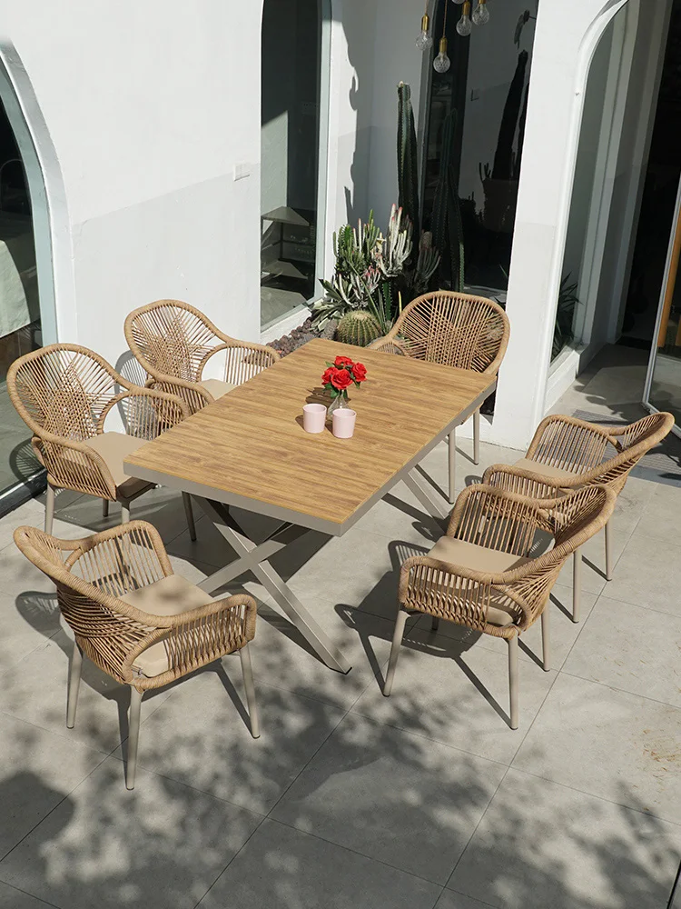 Outdoor tea shop with rattan tables and chairs outside courtyard garden terrace Modern dining table and chair combination