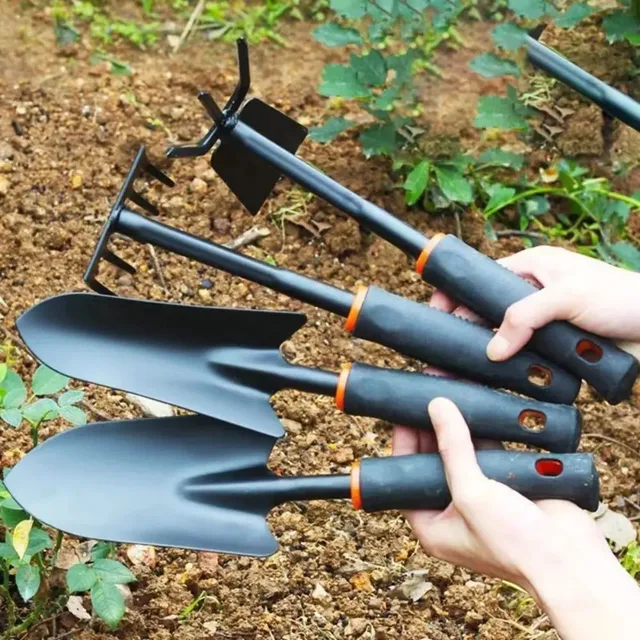Durable metal gardening trowel with ergonomic black handle and orange decoration - perfect for planting flowers and vegetables. 2
