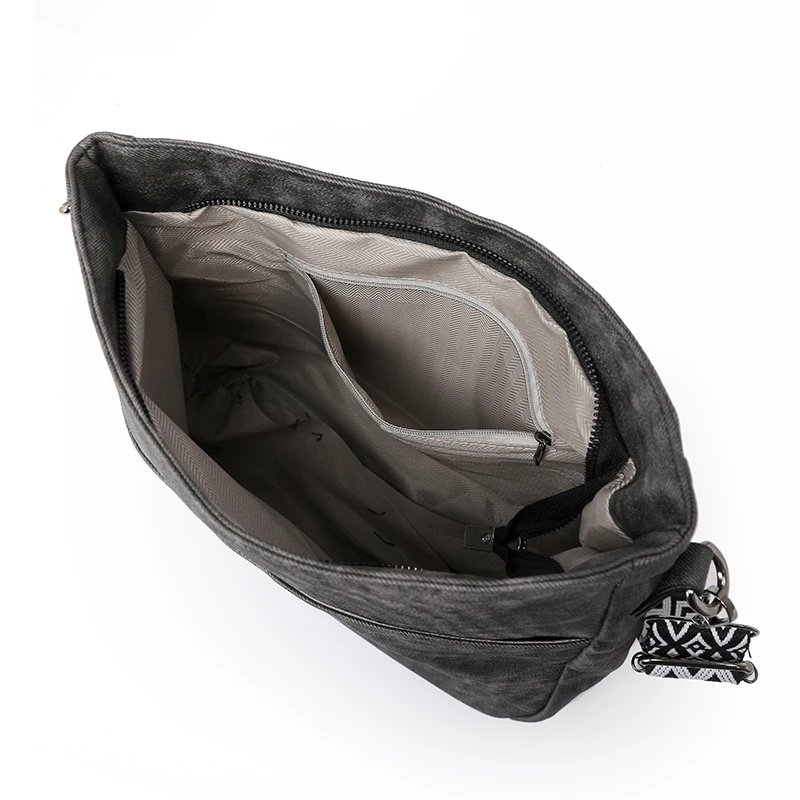 The women's single-shoulder crossbody bag is crafted from premium fabric and refined craftsmanship, featuring a minimalist and s