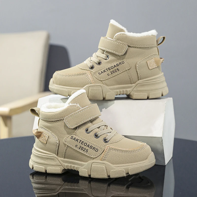 A pair of children's winter velvet warm snow boots with leather waterproof and anti-slip wear-resistant high-top cotton shoes
