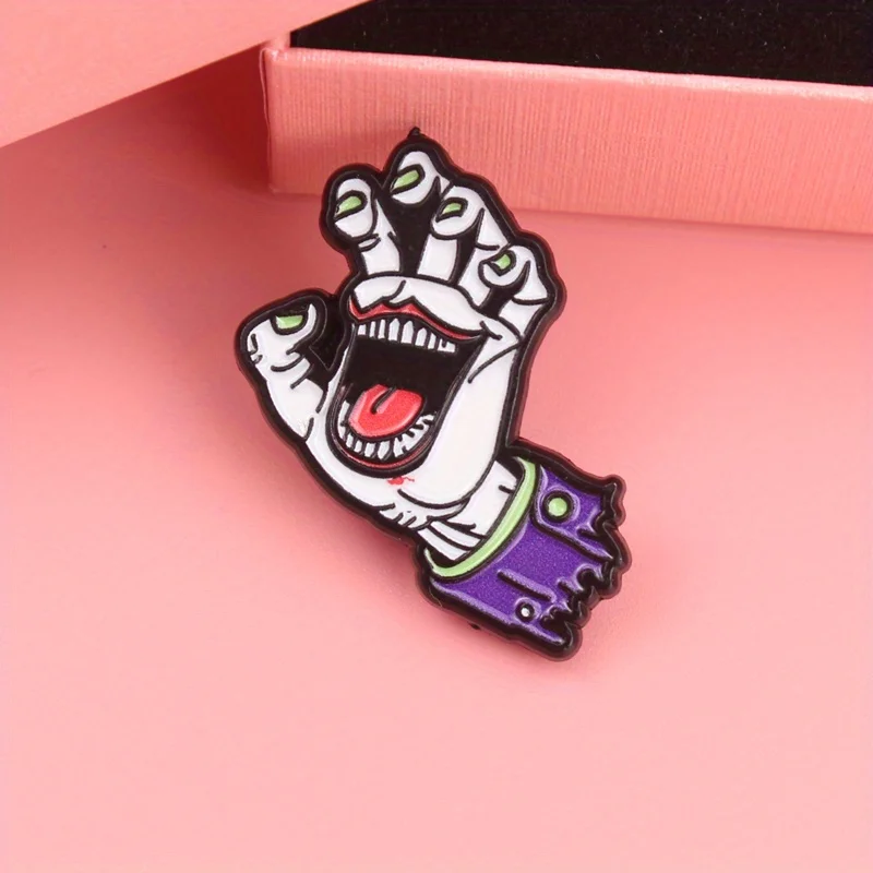 Zombie-Griffnadel – verfallende Hand mit leuchtenden grünen Krallen und blutigem Maw, makabreer Schmuck für Horrorcore-Mode-Brosche